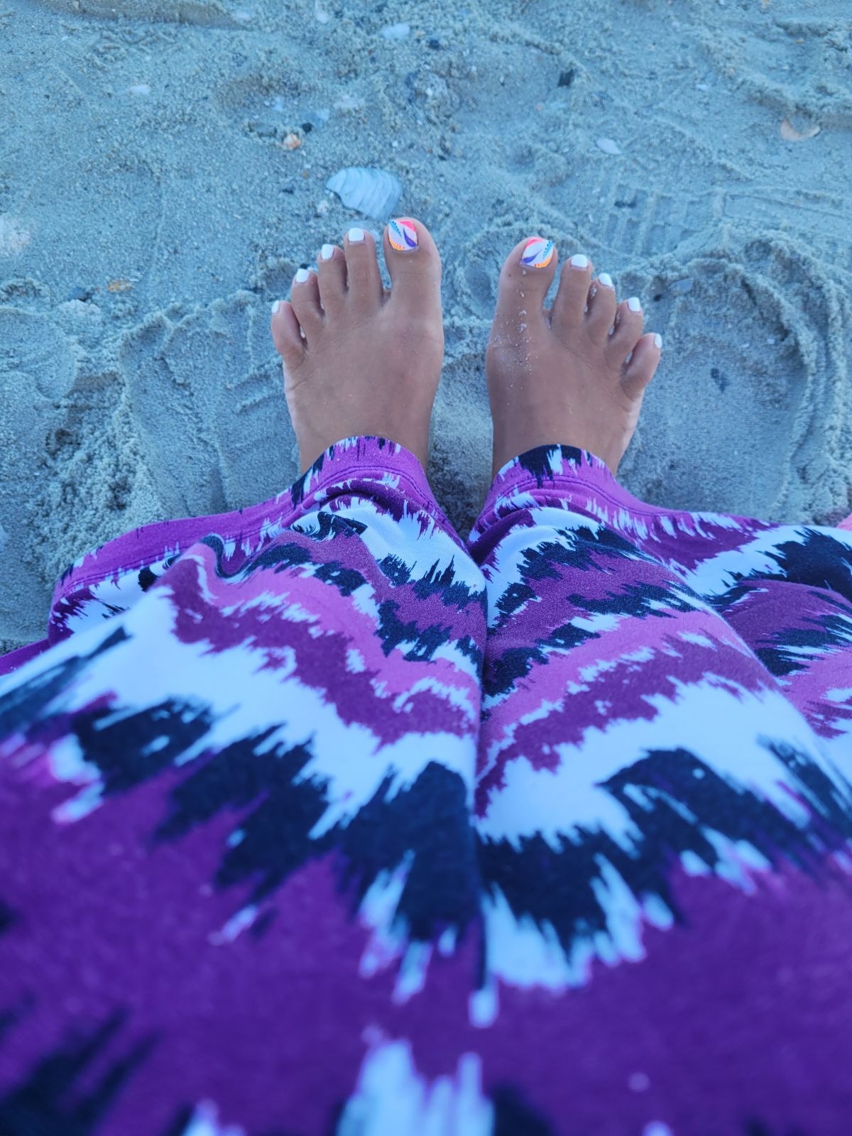 Feet grounded in beach sand